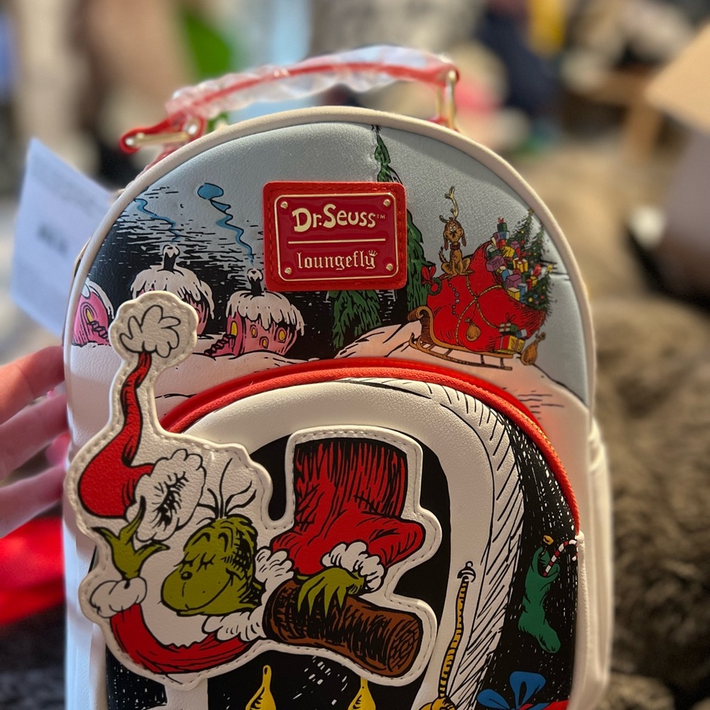 Loungefly grinch back pack and wallet. Sold as a set. Brand new with tags!